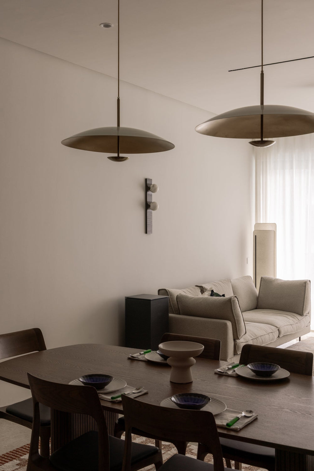 Completed Kuala Lumpur home with the dining table and living area designed as one connected space