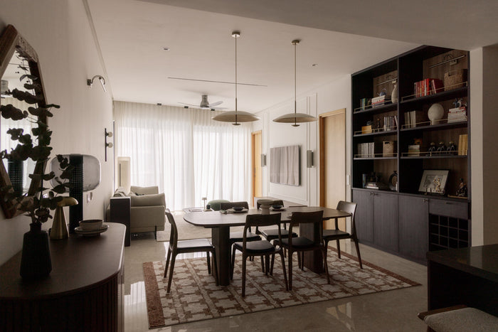 Open-plan condo living and dining room designed as one connected space