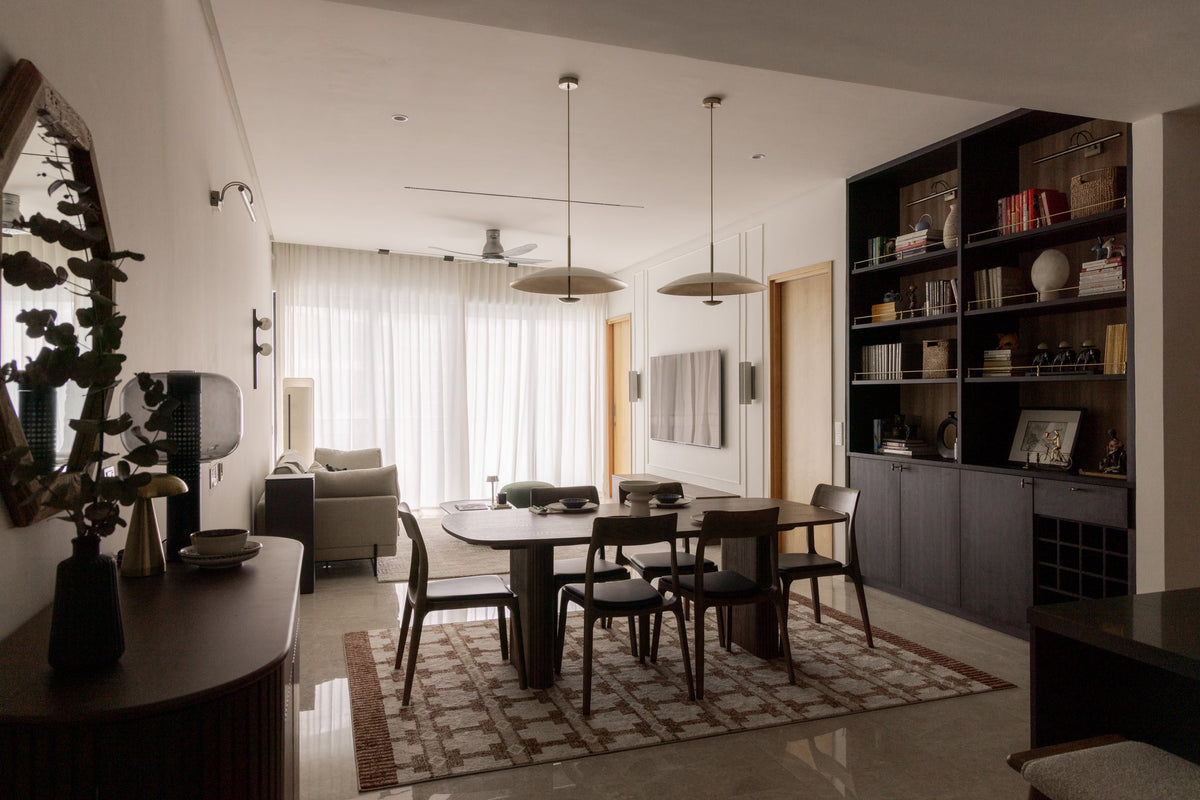 Open-plan condo living and dining room designed as one connected space