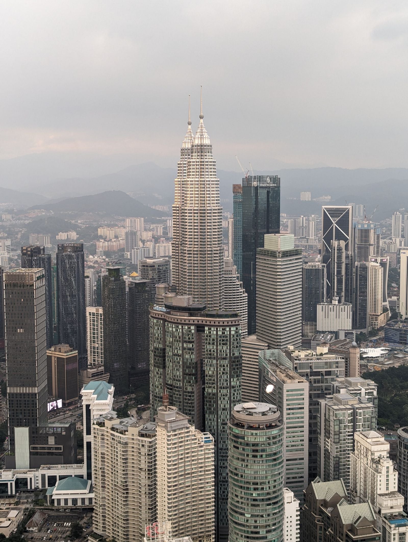 Aerial view of the Kuala Lumpur skyline with the Petronas Twin Towers