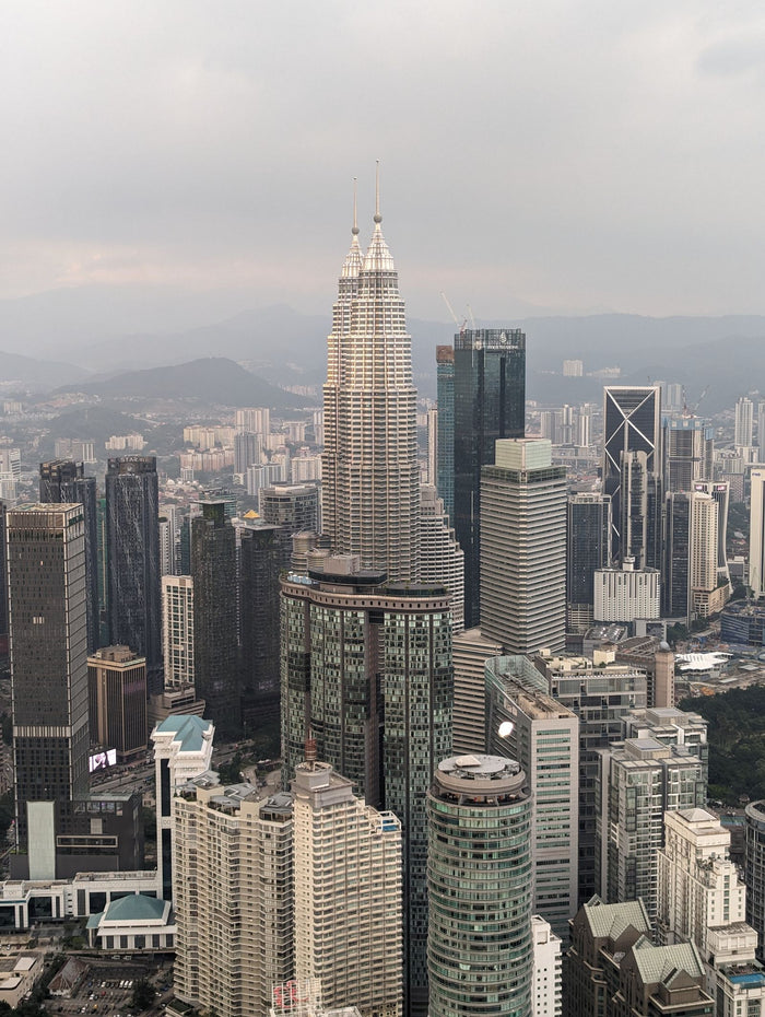 Aerial view of the Kuala Lumpur skyline with the Petronas Twin Towers