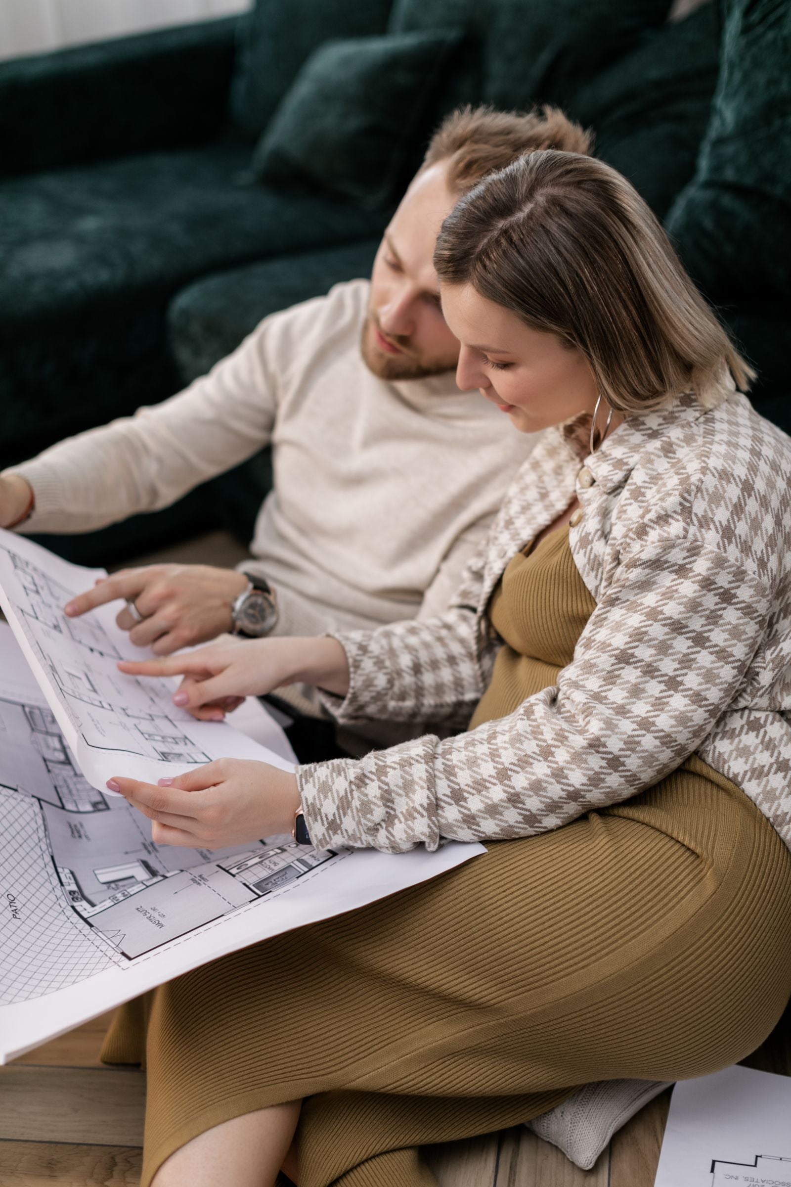 Couple reviewing a floor plan together while planning their home renovation