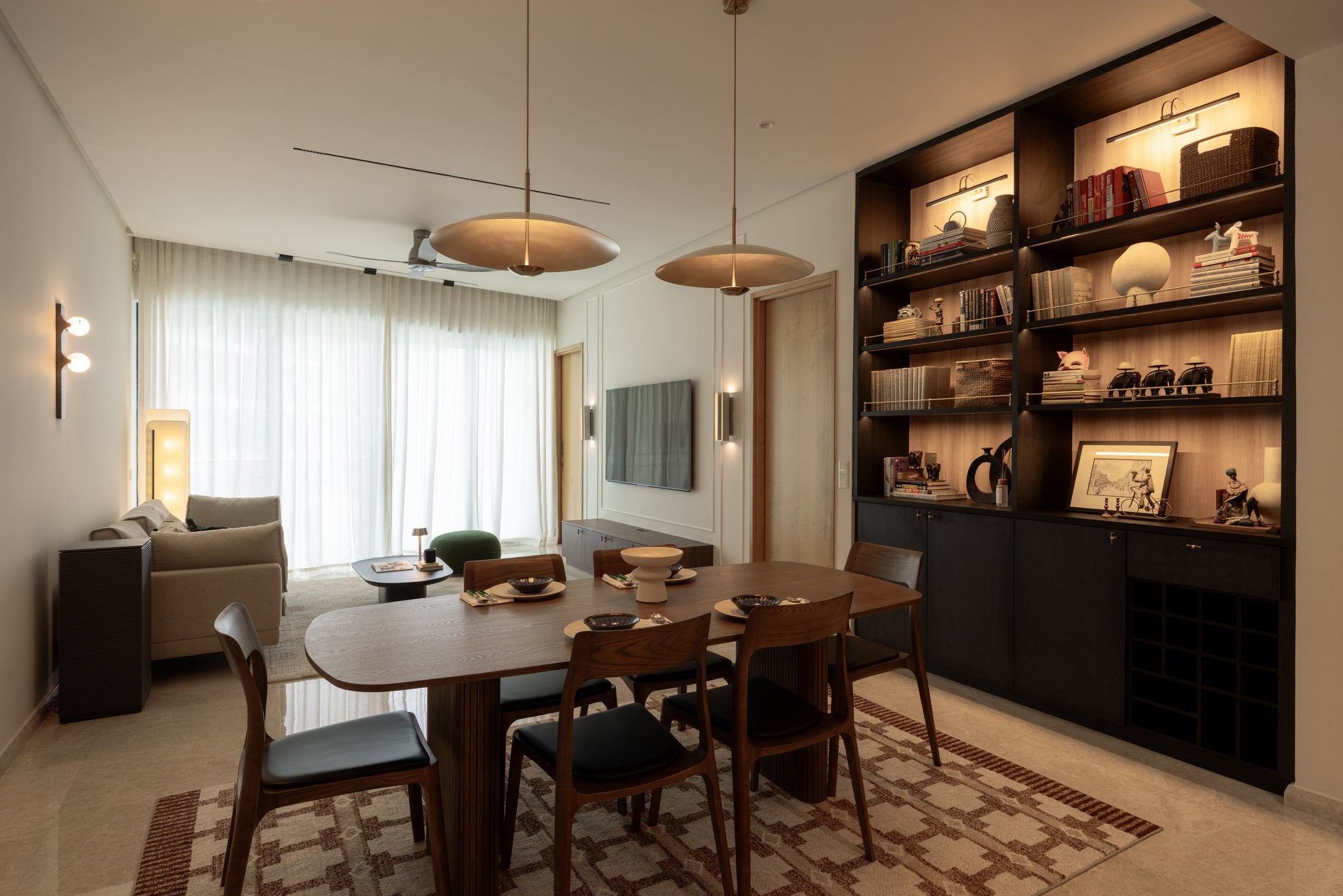 Open-plan living and dining room in a home Sundays in Bed designed at DC Residensi, Damansara Heights
