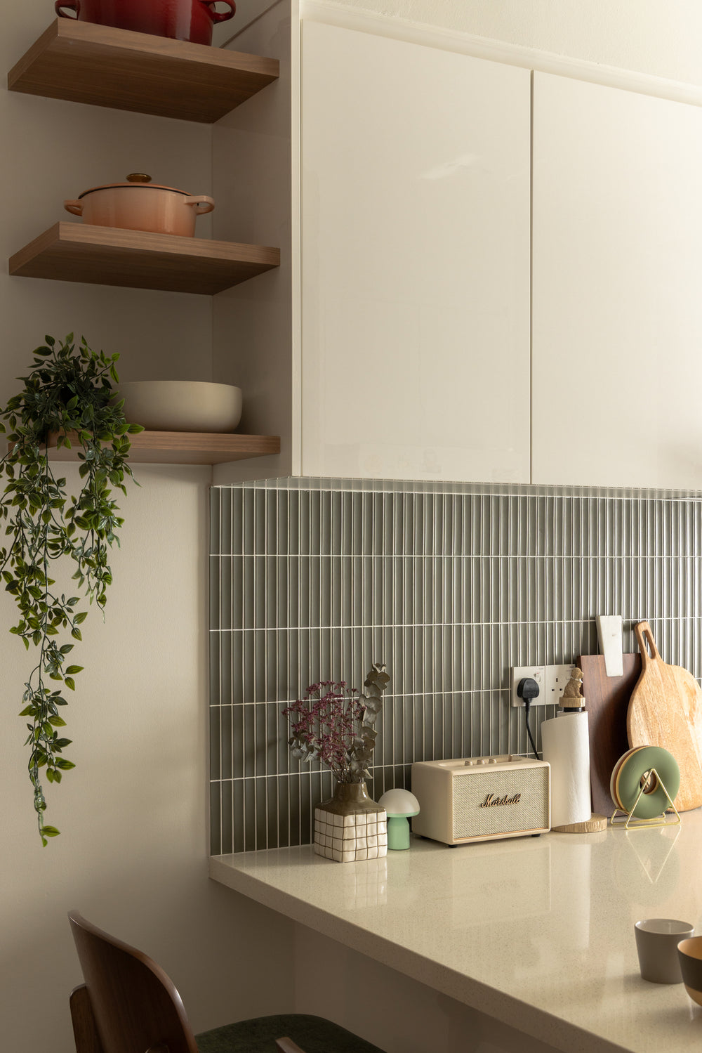Kitchen corner with sage stick tiles, warm oak open shelves and a pale quartz counter, in a home Sundays in Bed designed at Bangsar Hill Park
