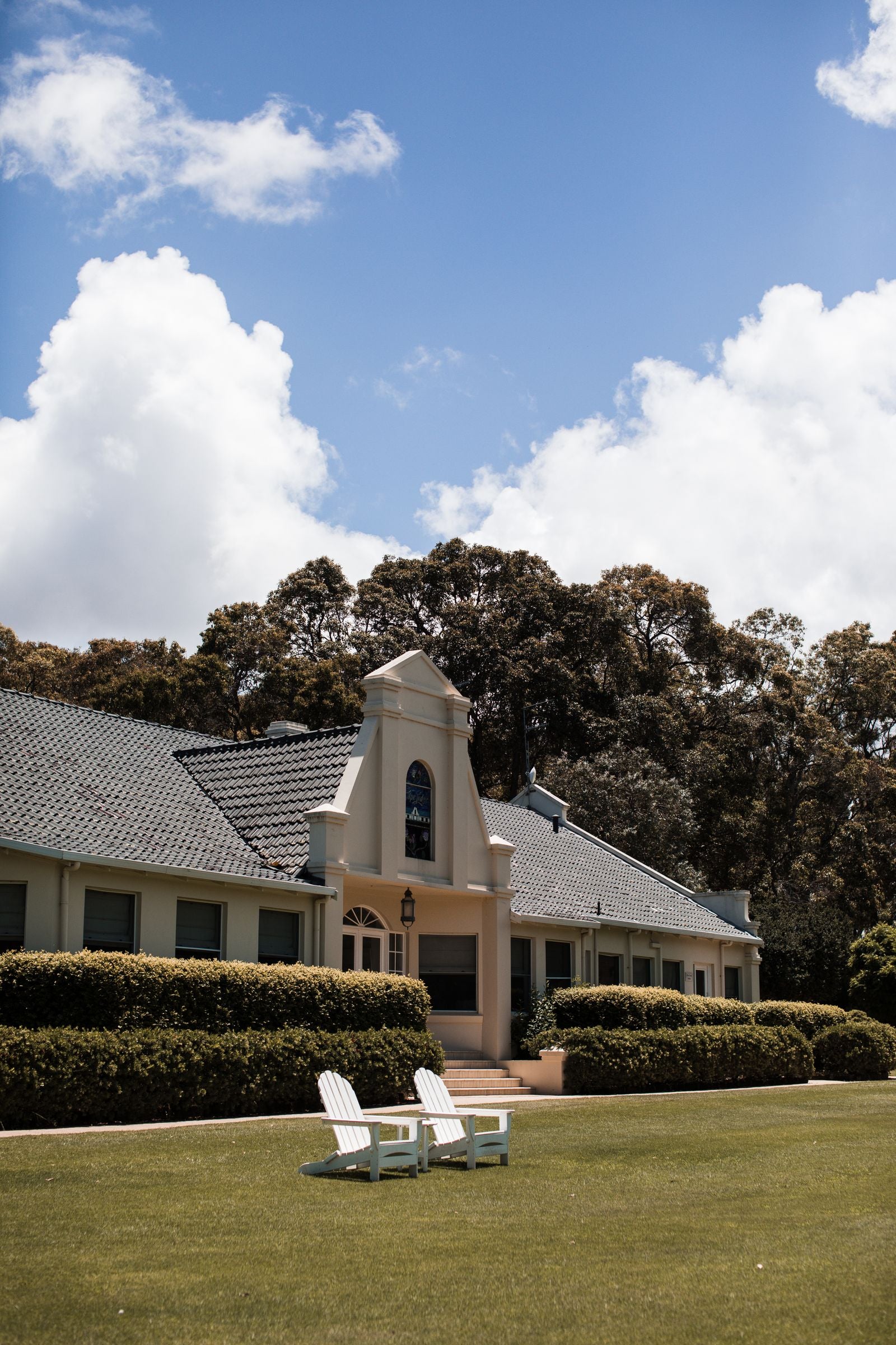 Exterior of a landed house with a green lawn, similar to homes in Bandar Utama
